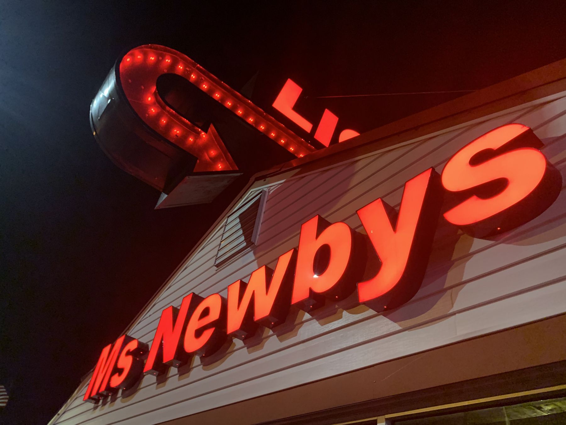Ms. Newby's neon sign on Thomas Drive