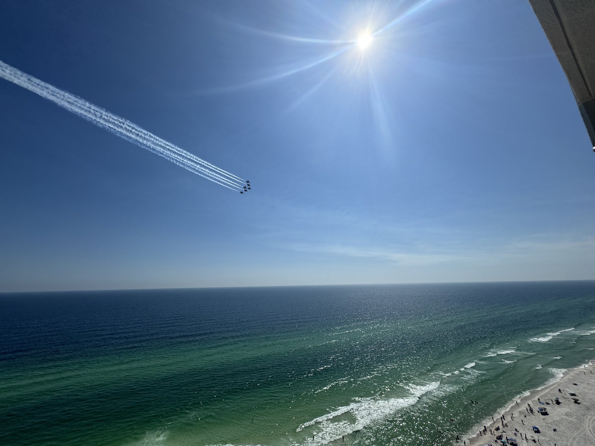 The Gulf from a balcony, with jets overhead